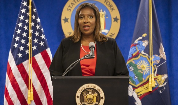 epa09392221 New York Attorney General Letitia James (C) speaks during a press conference with investigators Joon Kim and Anne Clark announcing the findings of their investigation that found that New Y ...