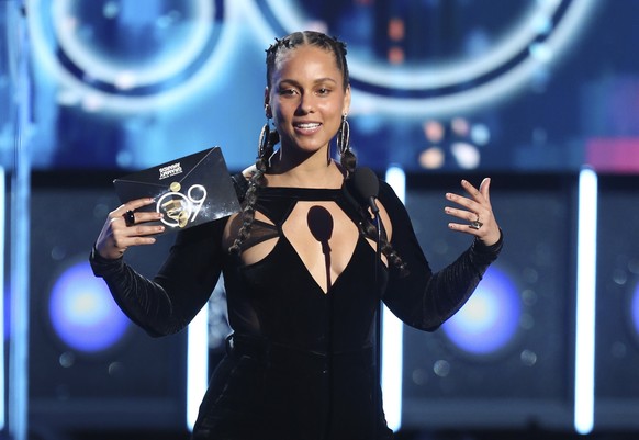FILE - In this Jan. 28, 2018 file photo, Alicia Keys presents the award for record of the year at the 60th annual Grammy Awards at Madison Square Garden in New York. The Recording Academy announced Tu ...