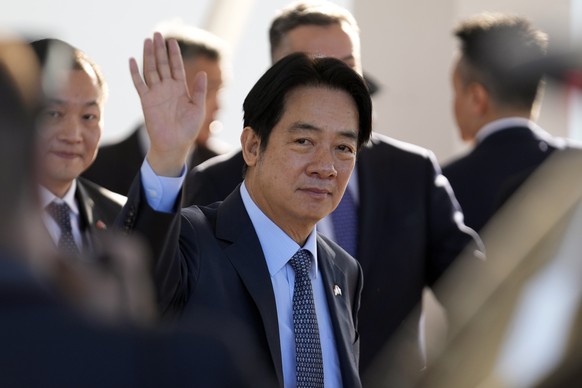 FILE - Taiwan Vice President William Lai Ching-te waves after landing at Silvio Pettirossi Airport in Luque, Paraguay, on August 14, 2023. The Chinese military launched exercises around Taiwan on Saturday...