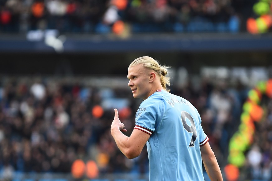 epa10219576 Erling Haaland of Manchester City celebrates after scoring a hat-trick during the English Premier League soccer match between Manchester City and Manchester United at Etihad Stadium in Man ...