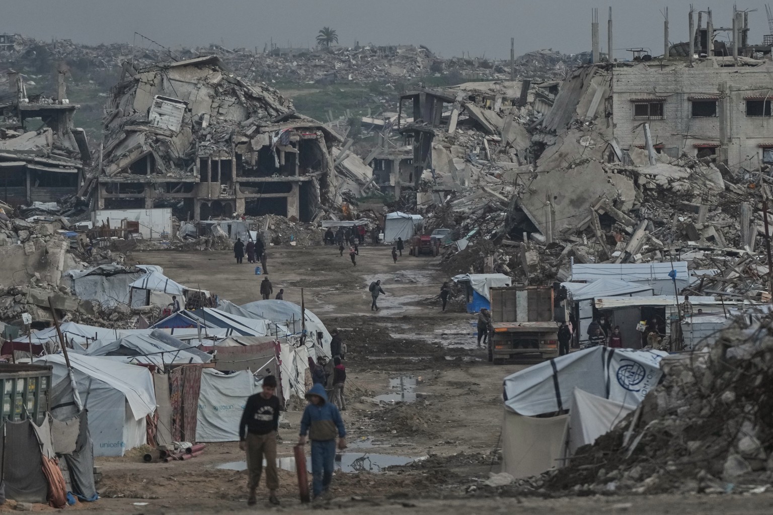 Palestinians walk amid buildings destroyed by Israeli air and ground operations in the Zeitoun neighborhood of Gaza City, Wednesday, Jan. 14, 2026. (AP Photo/Jehad Alshrafi)
Israel Palestinians Gaza