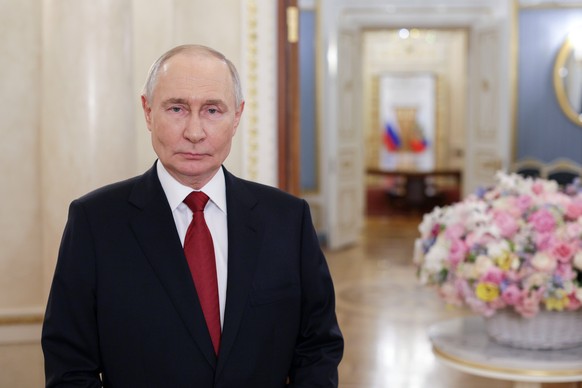 epa12802959 Russian President Vladimir Putin delivers a video address to congratulate Russia's women on International Women's Day in Moscow, Russia, 08 March 2026. EPA/GAVRIIL GRIGOROV / SPU ...