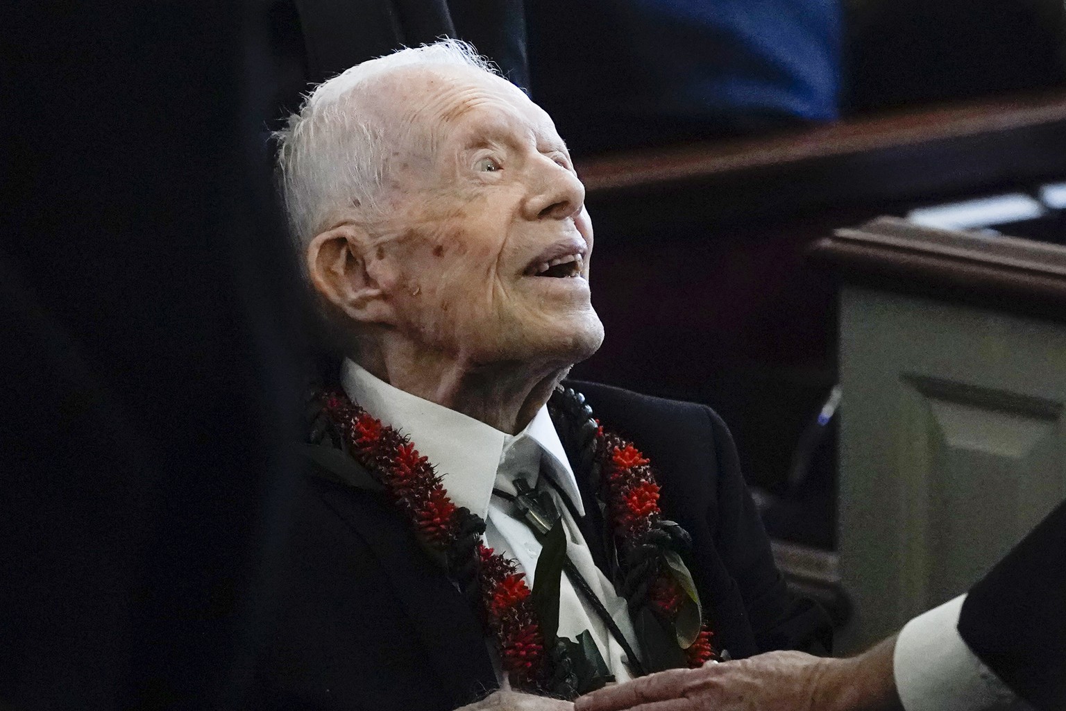 FILE - Former President Jimmy Carter greets attendees as he departs the funeral service for his wife, former first lady Rosalynn Carter, at Maranatha Baptist Church in Plains, Ga., Nov. 29, 2023. (AP  ...