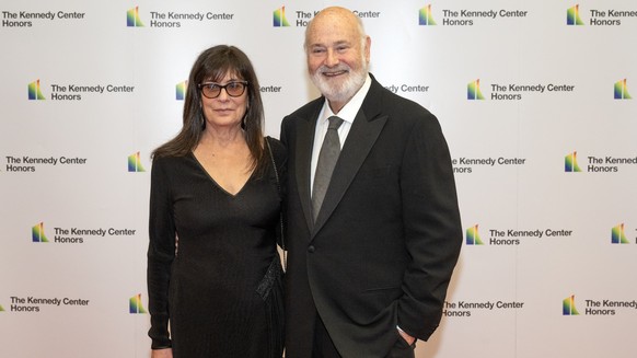 epa12593224 (FILE) - Rob Reiner (R) and Michelle Reiner (L) arrive for the Medallion Ceremony honoring the recipients of the 46th Annual Kennedy Center Honors at the Department of State in Washington, ...