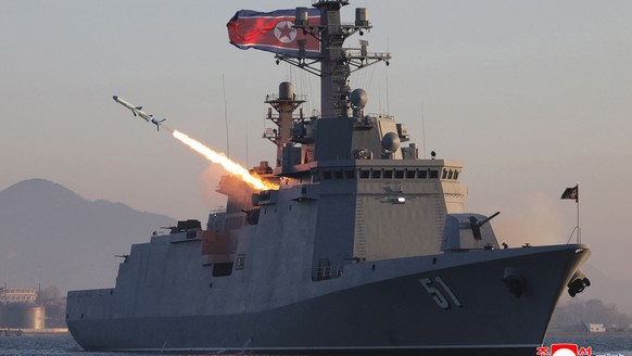 epaselect epa12888079 A photo released by the official North Korean Central News Agency (KCNA) shows a test-fire of strategic cruise missiles and anti-warship missiles from the destroyer Choe Hyon in  ...