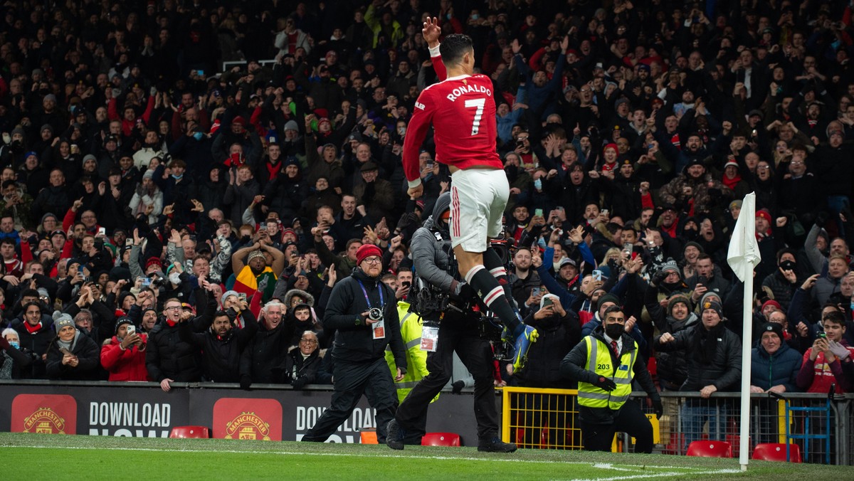epa09617722 Manchester United's Cristiano Ronaldo celebrates after scoring the 2-1 during the English Premier League soccer match between Manchester United and Arsenal FC in Manchester, Britain,  ...