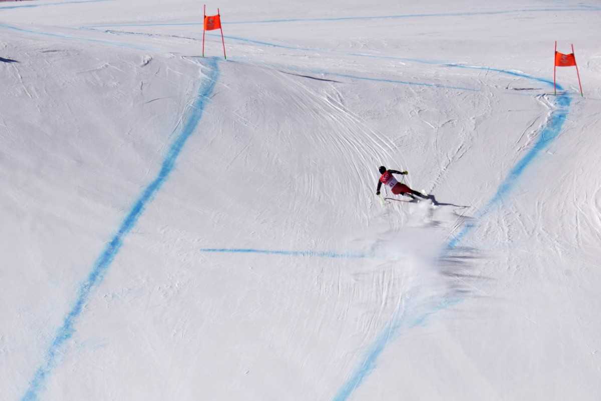 Broderick Thompson of Canada races down the course during a men's downhill training run at the 2022 Winter Olympics, Thursday, Feb. 3, 2022, in the Yanqing district of Beijing. (AP Photo/Luca Bru ...