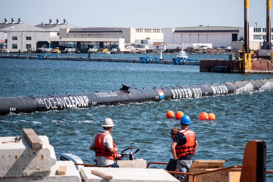 epa07004831 A handout photo made available by The Ocean Cleanup on 08 September 2018 shows The Ocean Cleanup System 001 floating in the lagoon in front of the assembly yard, in Alameda, California, US ...