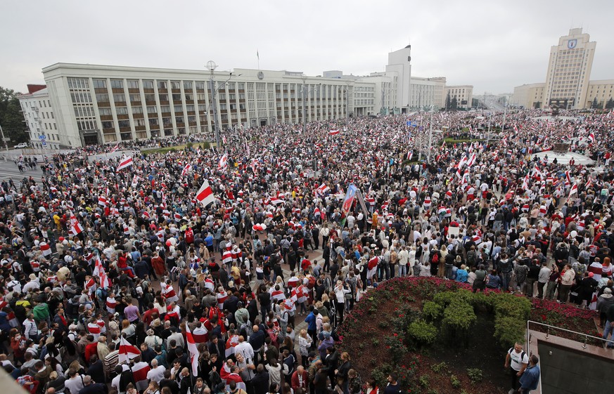 Thousands of people gather for a protest at the Independence square in Minsk, Belarus, Sunday, Aug. 23, 2020. Demonstrators are taking to the streets of the Belarusian capital and other cities, keepin ...