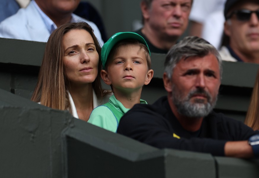 epa10724319 Jelena Djokovic, the wife of Novak Djokovic of Serbia and their son Stefan watch him play Pedro Cachin of Argentina in their 1st round match at the Wimbledon Championships, Wimbledon, Brit ...