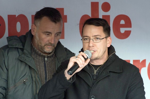 epa04693688 Swiss right-wing politician Ignaz Bearth (R) speaks beside Pegida movement initiator, Lutz Bachmann, during a demonstration at Altmarkt in Dresden, Germany, 06 April 2015. The 'Patriotic E ...