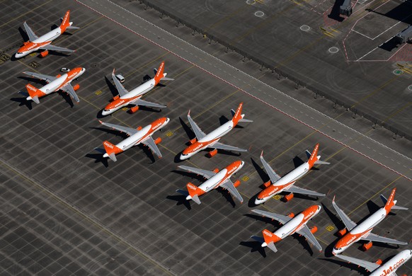 epa08519899 (FILE) - An aerial view shows air planes of EasyJet sitting on the tarmac at the Berlin Brandenburg International Airport BER in Schoenefeld, Germany, 23 April 2020 (reissued 01 July 2020) ...