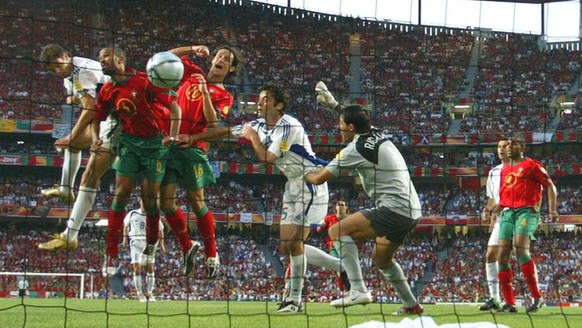 Greek striker Angelos Charisteas (left) scores the 1-0 lead during the Euro 2004 final between Portugal and Greece at Luz stadium in Lisbon on Sunday, 04 July 2004. EPA/ANTONIO SIMOES NO MOBILE PHONE  ...