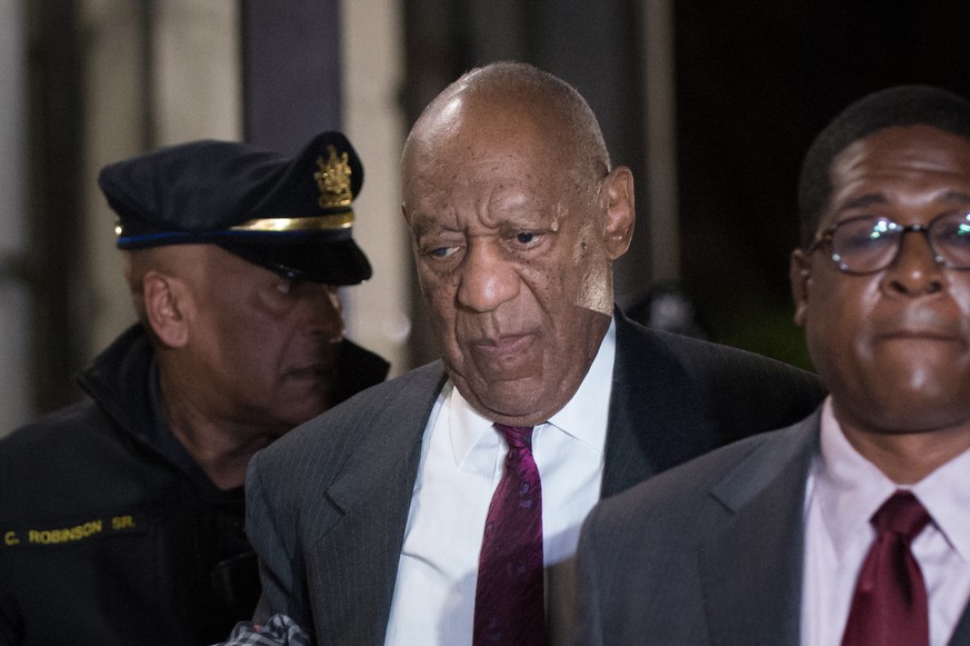 epa06709423 (FILE)- US entertainer Bill Cosby (C) departs the Montgomery County Courthouse in Norristown, Pennsylvania, USA, 25 April 2018 (issued 03 May 2018). In a statement the Academy of Motion Pi ...