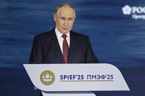 In this photo released by the Roscongress Foundation, Russian President Vladimir Putin speaks at a plenary session of the St. Petersburg International Econimic Forum in St. Petersburg, Russia, Friday, ...