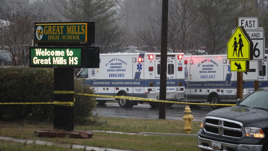 Deputies, federal agents and rescue personnel, converge on Great Mills High School, the scene of a shooting, Tuesday morning, March 20, 2018 in Great Mills, Md. (AP Photo/Alex Brandon )