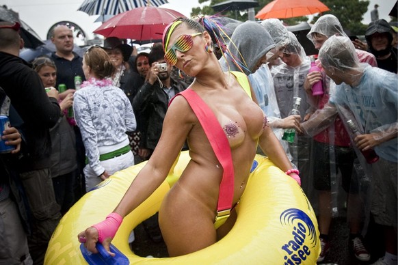 A female raver dances during the Street parade in Zurich, Switzerland, Saturday, August 8, 2009. Thousands of ravers join the 18. Street Parade despite enduring rainfalls. (KEYSTONE/Ennio Leanza)