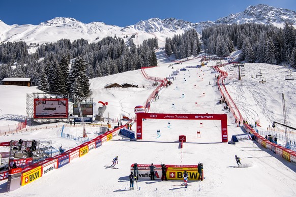 epa09083825 Justin Murisier (L) in action against Mattias Roenngren of Sweden during the quarter final of the Mixed Team Parallel race at the FIS Alpine Skiing World Cup finals, in Lenzerheide, Switze ...