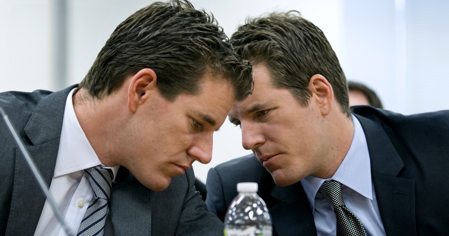 Brothers Cameron, left, and Tyler Winklevoss, Principals of Winklevoss Capital Management, share a word during a hearing called &quot;The Investor Perspective: The Future of Virtual Currencies&quot; i ...