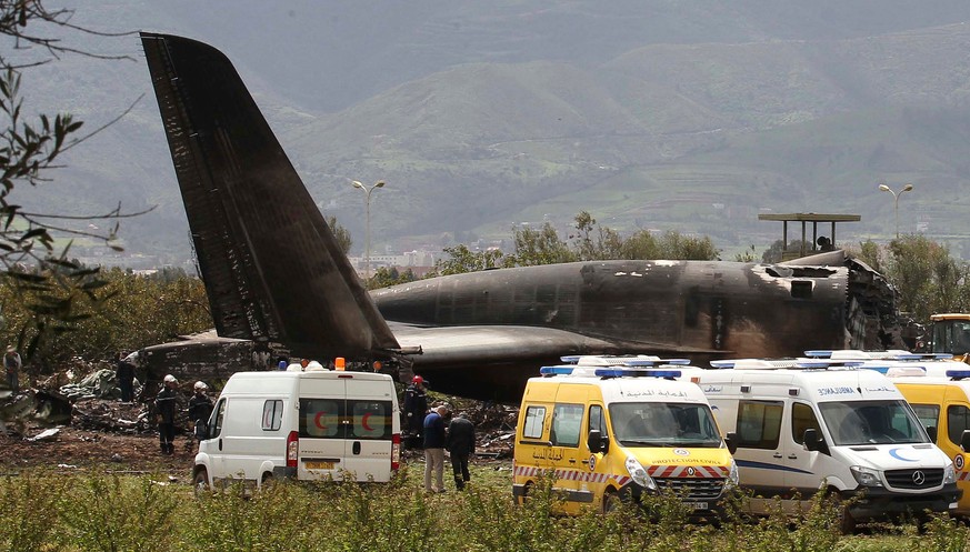 Firefighters and civil security officers work at the scene of a fatal military plane crash in Boufarik, near the Algerian capital, Algiers, Wednesday, April 11, 2018. Algerian emergency services say 1 ...