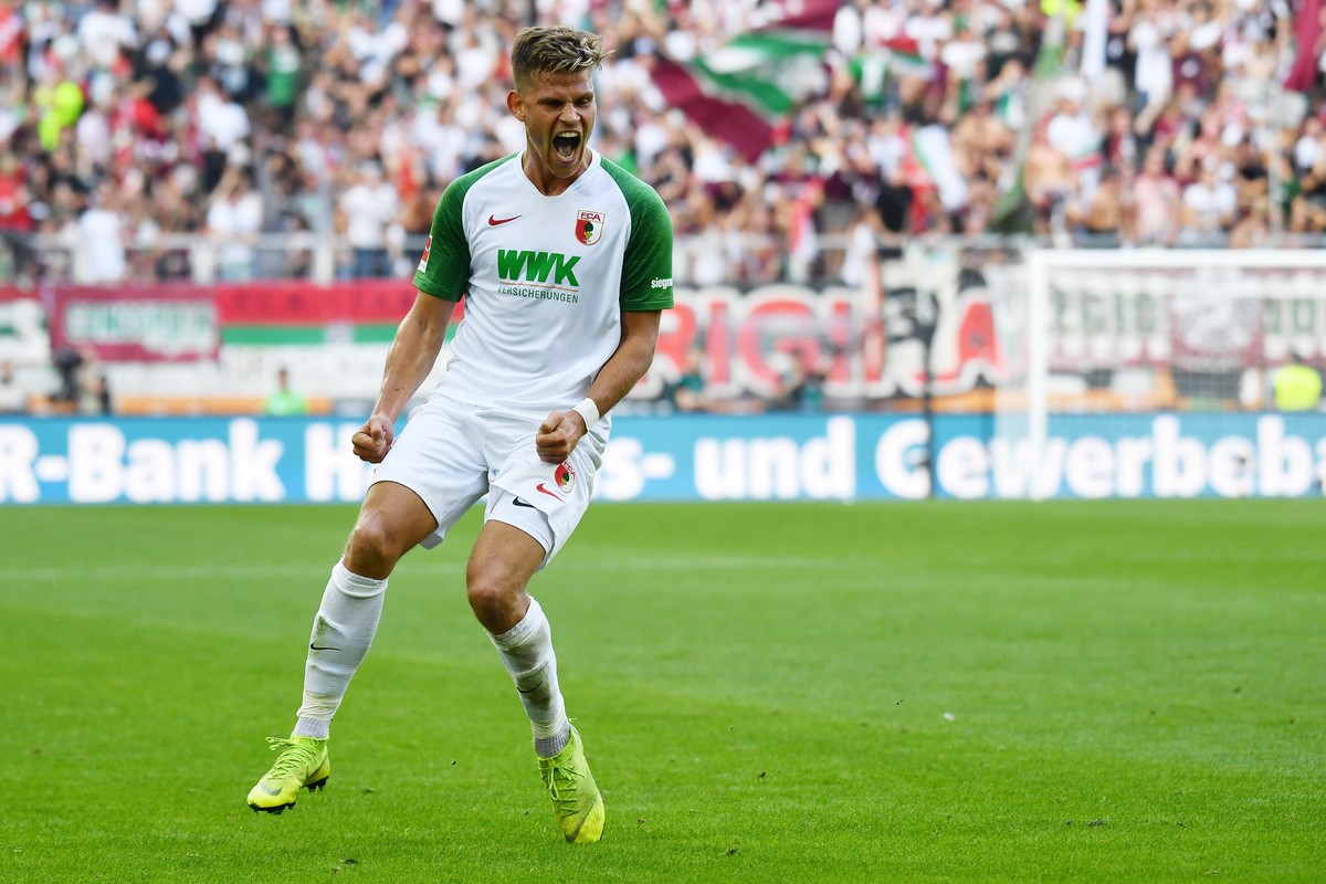 epa07842166 Augsburg's Florian Niederlechner celebrates scoring the 2-0 goal during the German Bundesliga soccer match between FC Augsburg and Eintracht Frankfurt in Augsburg, Germany, 14 Septemb ...