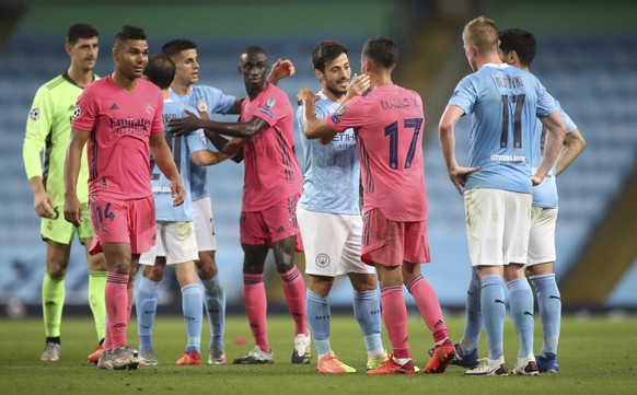 epa08590673 Manchester City and Real Madrid players after the UEFA Champions League Round of 16 second leg soccer match between Manchester City and Real Madrid in Manchester, Britain, 07 August 2020.  ...