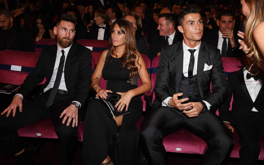epa06284925 British television presenter Layla Anna Lee speaks to Portugal and Real Madrid forward Cristiano Ronaldo as Argentine international and Barcelona forward Lionel Messi (L) and his wife Anto ...