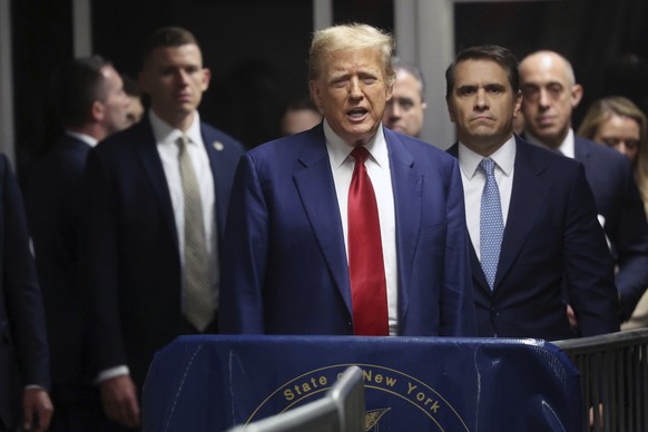 Former President Donald Trump speaks from the hallway outside a courtroom where he is attending a hearing at New York Criminal Court, Monday, March 25, 2024, in New York. Trump&#039;s hush money case  ...