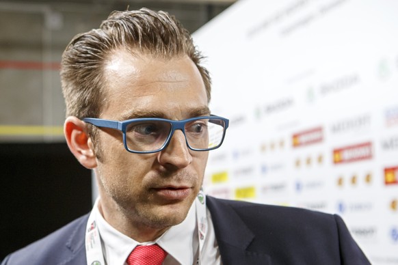 Raeto Raffainer, center, Director of National Teams of the Swiss Ice Hockey, speaks to the media, during a Swiss team training optional session of the IIHF 2018 World Championship, at the Royal Arena, ...