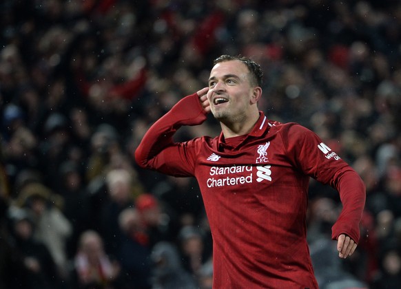 epa07236059 Xherdan Shaqiri of Liverpool celebrates after scoring the 3-1 goal during the English Premier League soccer match between Liverpool FC and Manchester United FC at Anfield in Liverpool, Bri ...