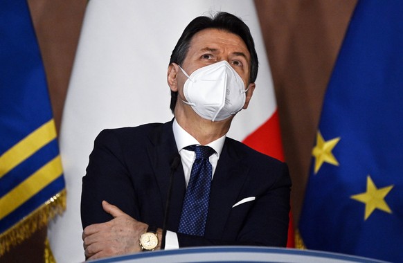 epa08911296 Italian premier Giuseppe Conte reacts during the year-end press conference organized by the Order of Journalists (ODG) at Villa Madama, Rome, Italy, 30 December 2020. EPA/Riccardo Antimian ...