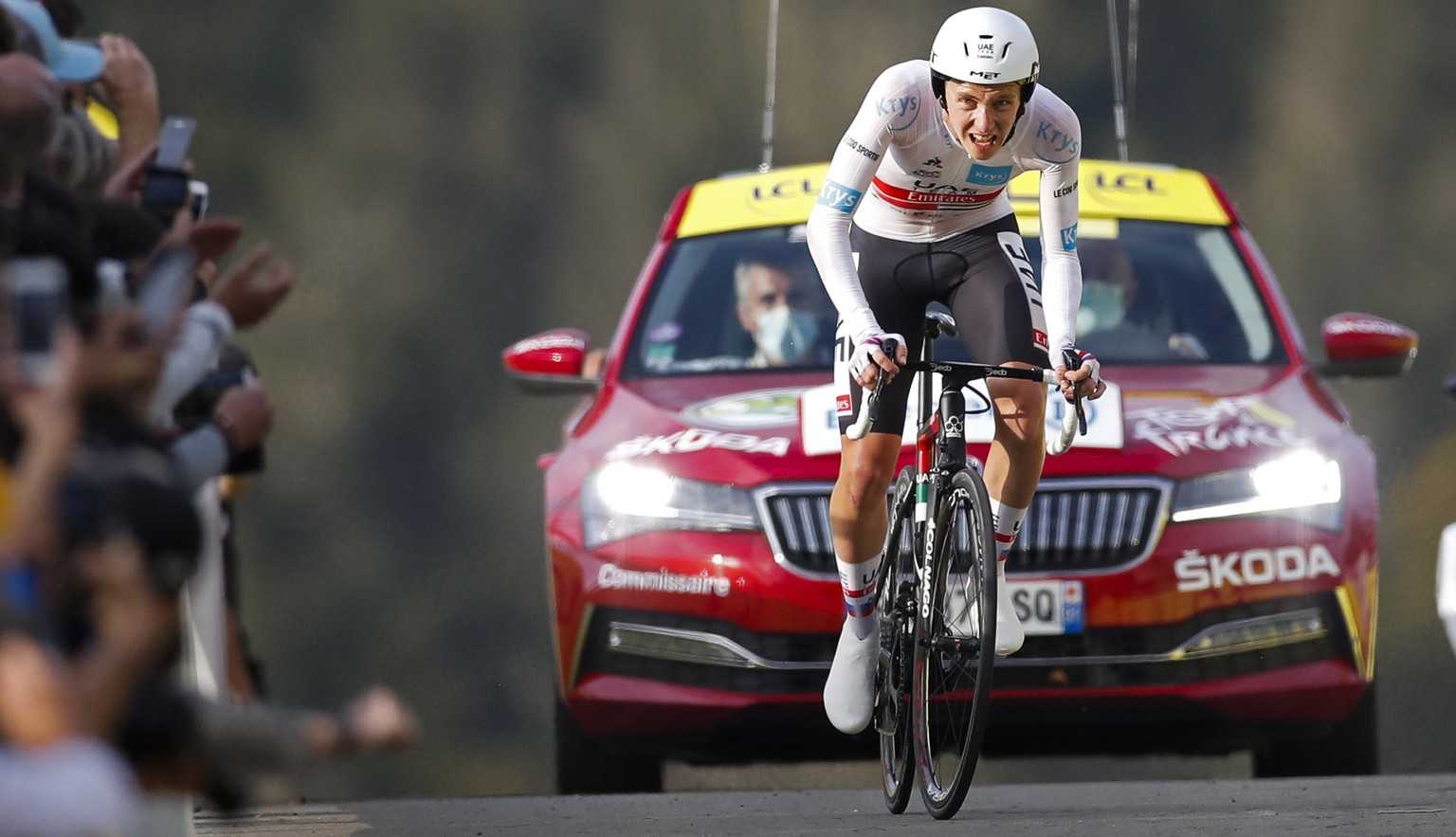 Slovenia&#039;s Tadej Pogacar wins and takes the overall leader&#039;s yellow jersey as he crosses the finish line of stage 20 of the Tour de France cycling race, an individual time trial over 36.2 ki ...