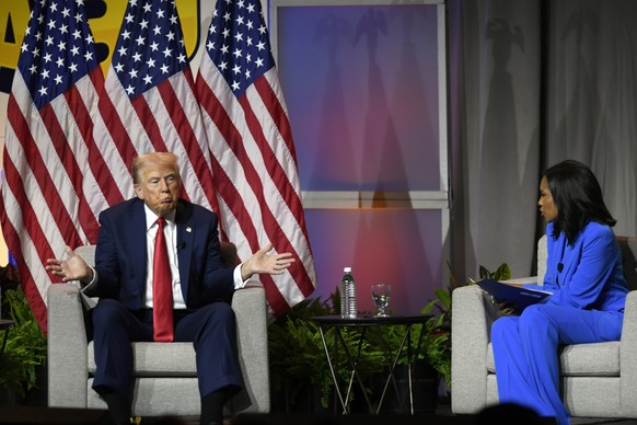 Republican presidential candidate Donald Trump left, participates in a discussion at the National Association of Black Journalists Convention and Career Fair in Chicago, Wednesday, July 31, 2024. (AP  ...