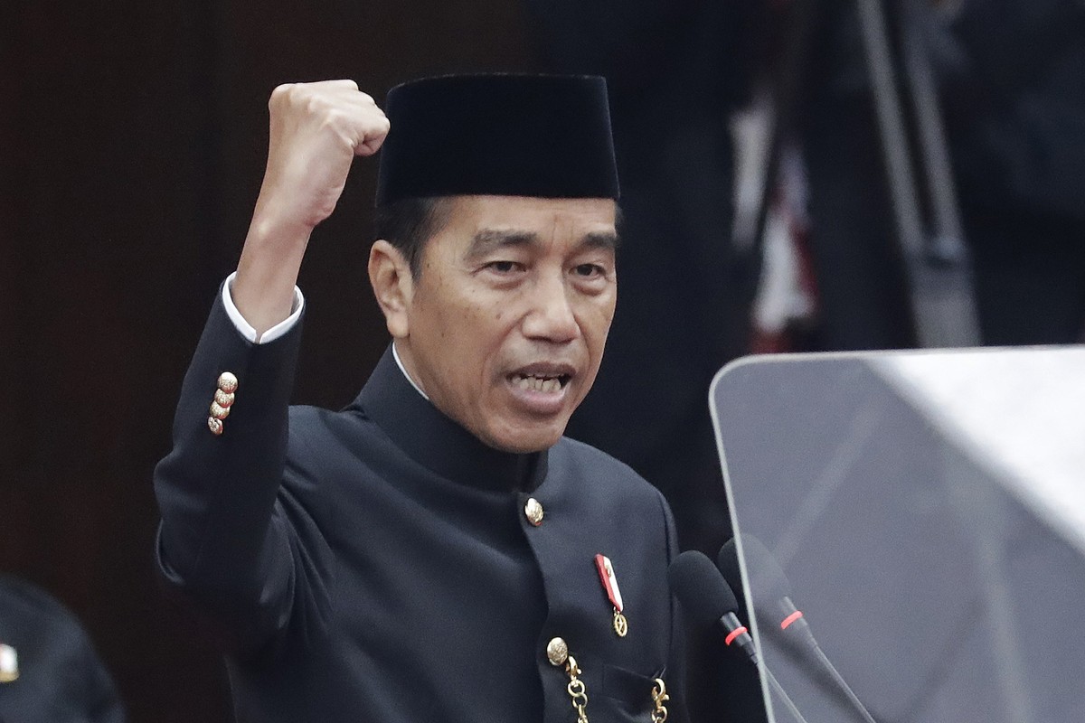 Indonesia's outgoing President Joko Widodo, wearing traditional Jakarta outfit, delivers his final State of the Nation Address ahead of the country's Independence Day, at the parliament buil ...