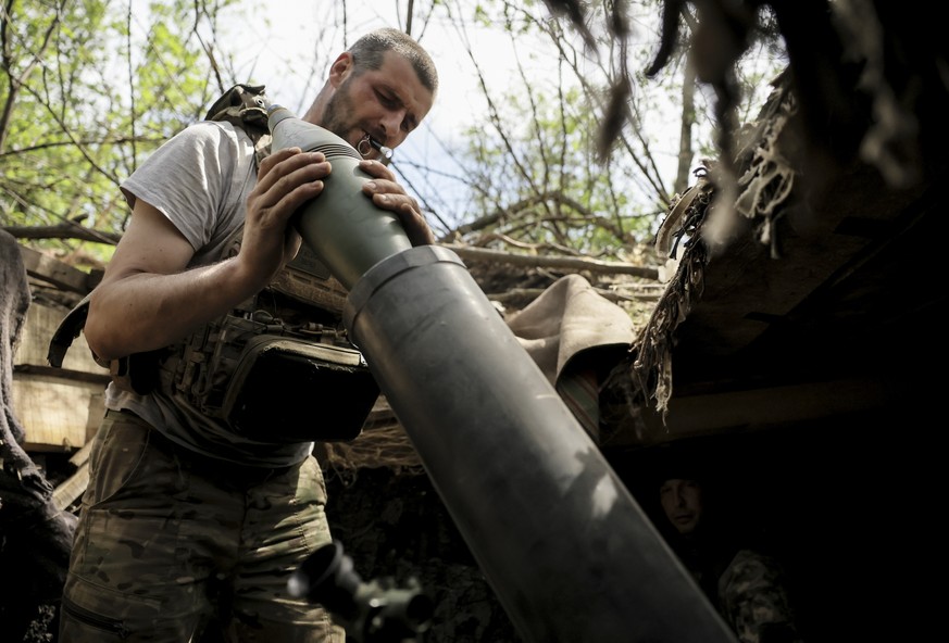 epa12142394 A handout photo made available by the press service of the 24th Mechanized Brigade of Ukrainian Armed Forces, shows a serviceman from the 2nd Rifle Battalion of the 24th Mechanised Brigade ...