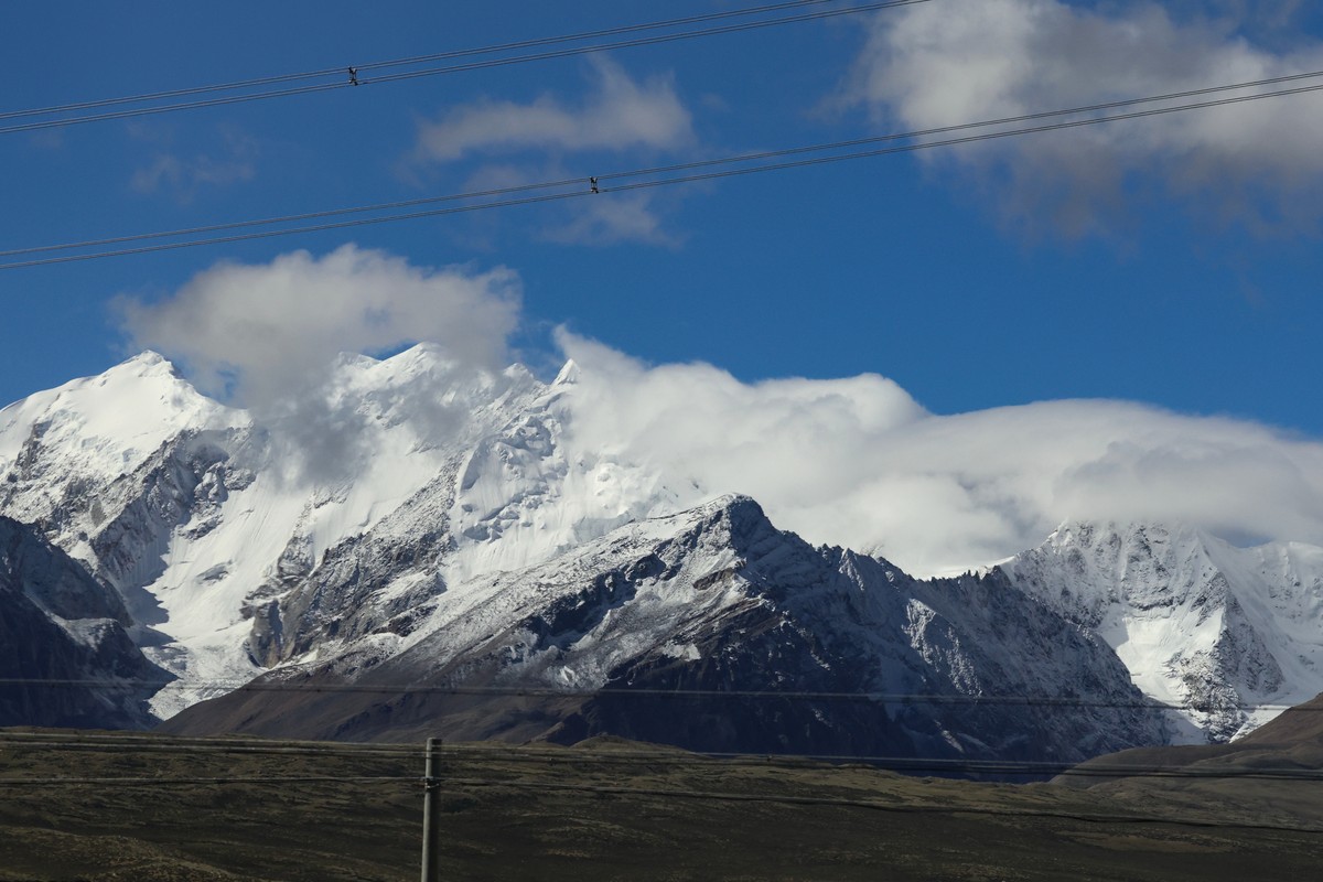 Snow-covered peaks of the Himalayas are seen during a media tour, from Shigatse, Tibet autonomous region, China, Sunday, Sept. 6, 2026. (Tingshu Wang/Pool Photo via AP)
China Tibet Nepal Floods