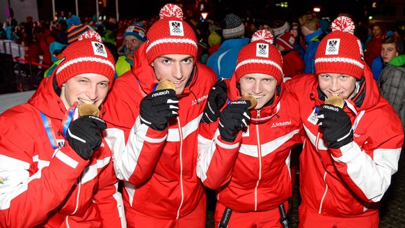 OLYMPICS - EYOF 2015 SCHRUNS-TSCHAGGUNS,AUSTRIA,29.JAN.15 - OLYMPICS, NORDIC SKIING, NORDIC COMBINED - European Youth Olympic Festival 2015, Medals Plaza, award ceremony. Image shows Daniel Rieder, Ph ...