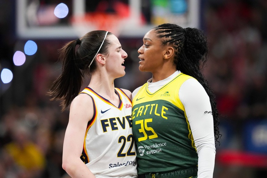 Syndication: The Indianapolis Star Indiana Fever guard Caitlin Clark 22 talks to Seattle Storm guard Victoria Vivians 35 following being run into after making a three-pointer, Thursday, May 30, 2024,  ...