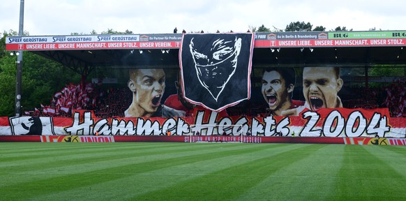 epa07534000 Supporters of FC Union Berlin unroll a banner prior to the German Bundesliga second division soccer match between FC Union Berlin and Hamburger SV in Berlin, Germany, 28 April 2019. EPA/CL ...