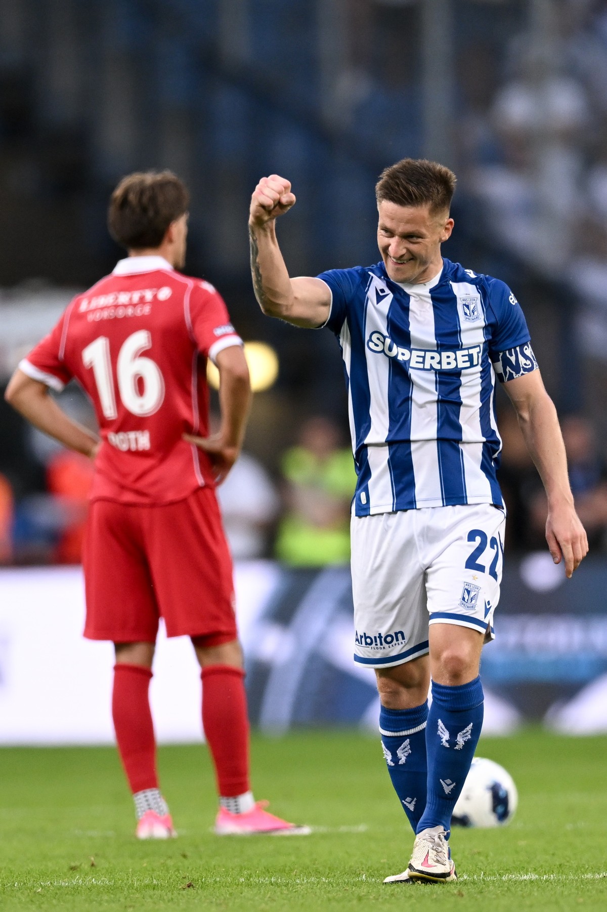 epa13181222 Radoslaw Murawski (R) of Lech Poznan celebrates after scoring a goal during the UEFA Europa League qualifying match between Lech Poznan and FC Thun 1898 in Poznan, Poland, 20 August 2026.  ...