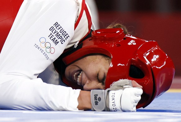 epa09363712 Refugee Olympic Team&#039;s Kimia Alizadeh Zenoorin reacts during her match against China&#039;s Zhou Lijun in the Taekwondo Women -57kg quarterfinal of the Tokyo 2020 Olympics at the Maku ...