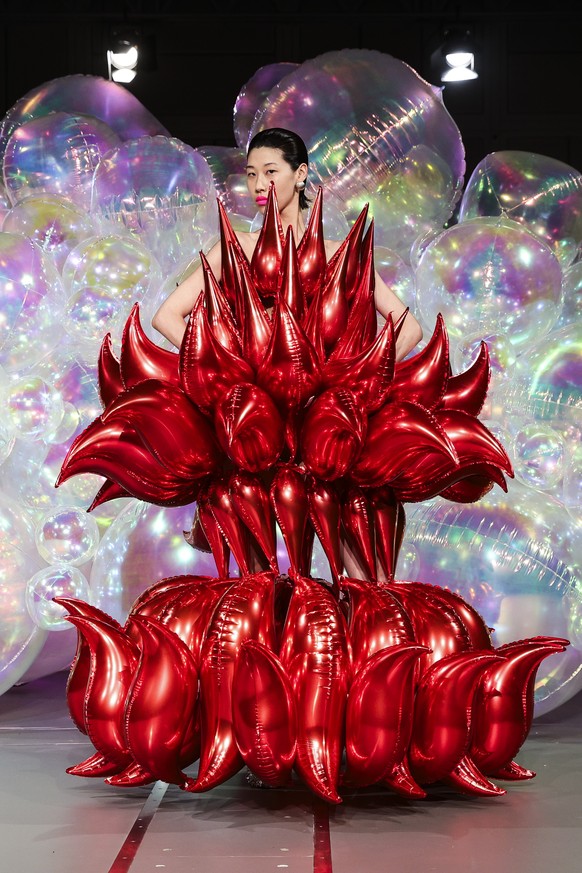 epa12229866 A model presents a creation from the Haute Couture Autumn/Winter 2025/2026 collection by Swiss designer Kevin Germanier for his label Germanier during Paris Fashion Week, in Paris, France, ...