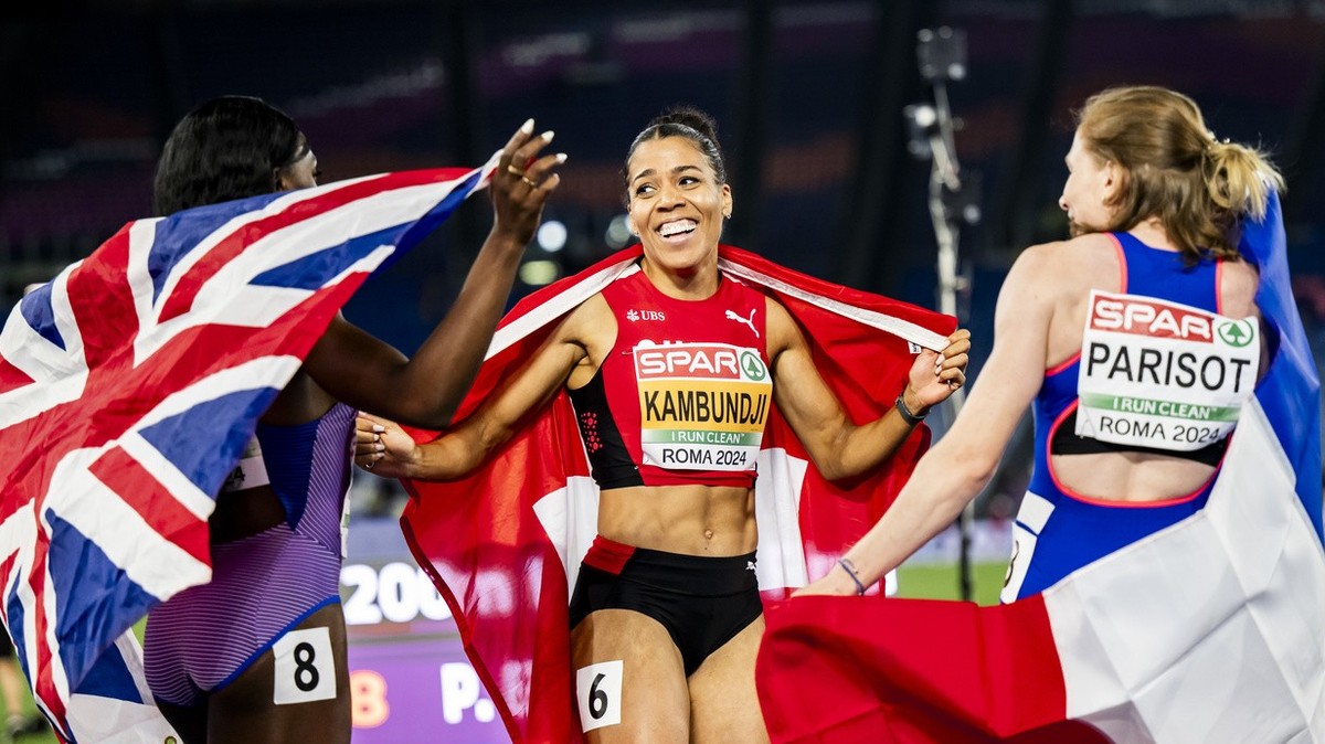 Gold medalist Mujinga Kambundji of Switzerland celebrates during the women's 200 meters final nex to Daryll Neita of Great Britain and Helene Parisot of France at the European Athletics Champions ...