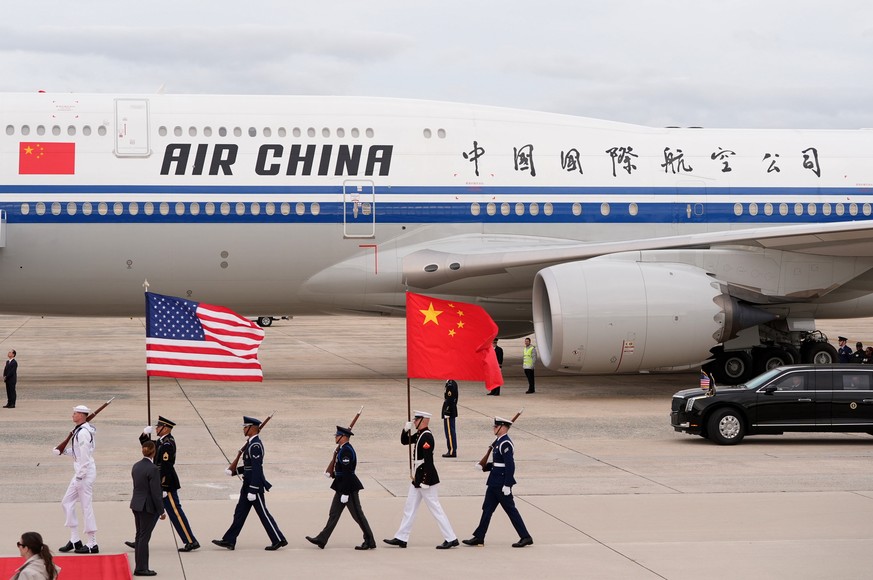 Flags are marched in as an Air China airplane with Chinese President Xi Jinping and his wife Peng Liyuan aboard, arrives at Joint Base Andrews, Md., Wednesday, Sept. 23, 2026. (AP Photo/Mark Schiefelb ...