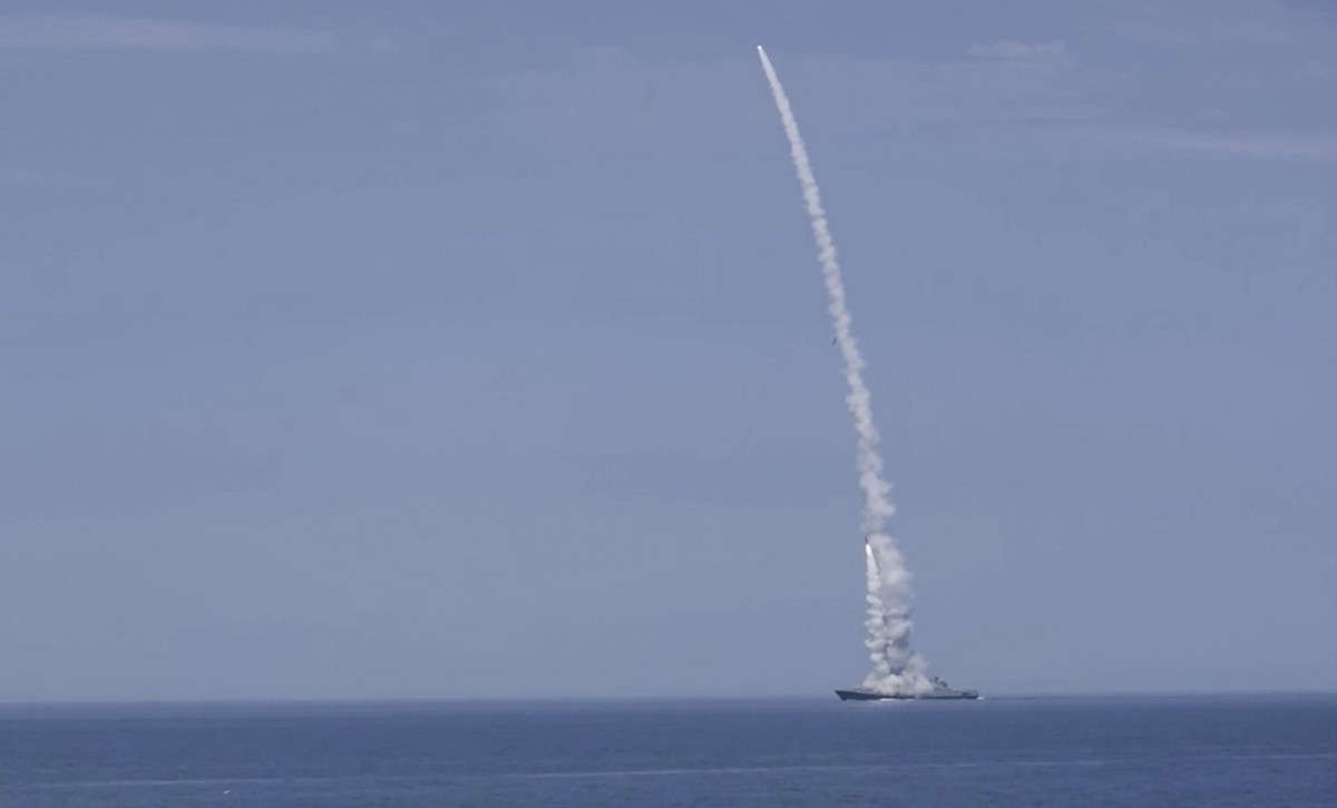 epa10234441 A still image taken from a handout video made available by the Russian Defence Ministry press service on 10 October 2022, of a Russian warship firing missiles at an undisclosed location in ...