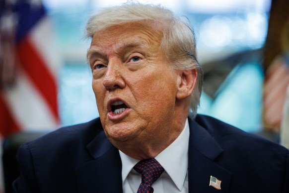 epa12381329 US President Donald Trump speaks from the Resolute desk after signing a Presidential Memorandum in the Oval Office at the White House in Washington, DC, USA, 15 September 2025. Trump is se ...