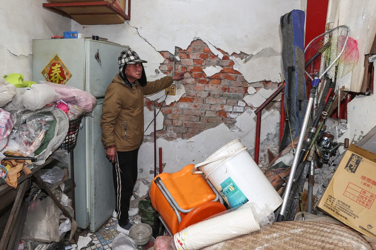 A man shows damage to his home after an earthquake in Tainan on January 21, 2025. A 6.0-magnitude earthquake hit Taiwan on January 21, the US Geological Survey said, injuring 27 people and causing cei ...
