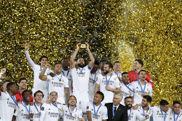 epaselect epa10462107 Players of Real Madrid celebrate with the trophy after winning the FIFA Club World Cup final between Real Madrid and Al Hilal SFC in Rabat, Morocco, 11 February 2023. EPA/Mohamed ...