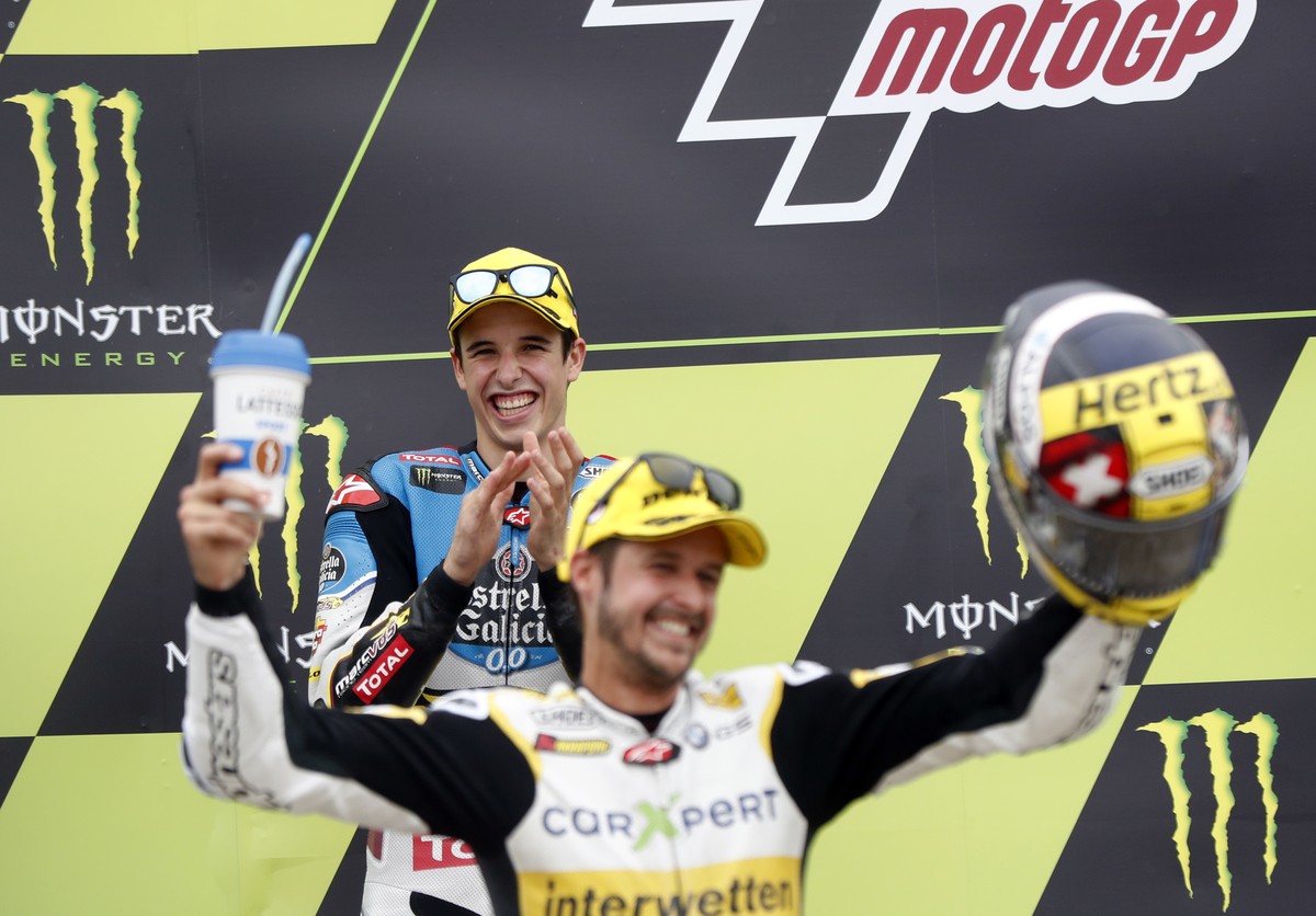 Second placed Spain's Alex Marquez of the EG 0,0 Marc VDS team applauds as Moto2 race winner Switzerland's Thomas Luthi of the CarXpert Interwetten celebrates after the Moto2 race at the Cze ...