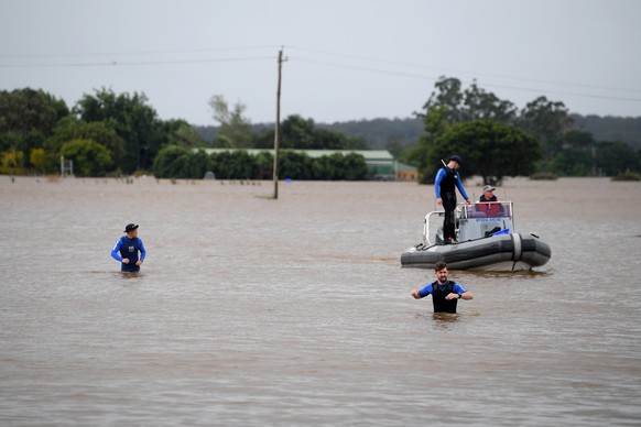 epa09798184 New South Wales Police Rescue are seen patrolling in floodwater at Windsor, north west of Sydney, New South Wales, 03 March 2022. A developing low pressure system is expected to intensify  ...